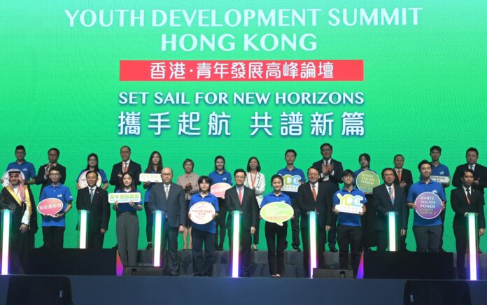 The Chief Executive, Mr John Lee, attended the Youth Development Summit today (August 10). Photo shows Mr Lee (front row, centre); the Director of the Liaison Office of the Central People's Government in the Hong Kong Special Administrative Region (HKSAR), Mr Zheng Yanxiong (front row, seventh left); the Chief Secretary for Administration, Mr Chan Kwok-ki (front row, seventh right); the Commissioner of the Ministry of Foreign Affairs in the HKSAR, Mr Cui Jianchun (front row, fifth left); the Secretary for Home and Youth Affairs, Miss Alice Mak (front row, first right); Deputy Minister of Education and Sports of Lao People's Democratic Republic Mr Kingmano Phommahaxay (front row, fifth right); Deputy Minister for Society Development of the Ministry of Human Resources and Social Development of the Kingdom of Saudi Arabia Mr Ahmed Al-Majed (front row, third left); and Deputy Minister of Youth and Sports of Malaysia Mr Adam Adli Abd Halim (front row, third right), with other guests and youth representatives at the Summit.